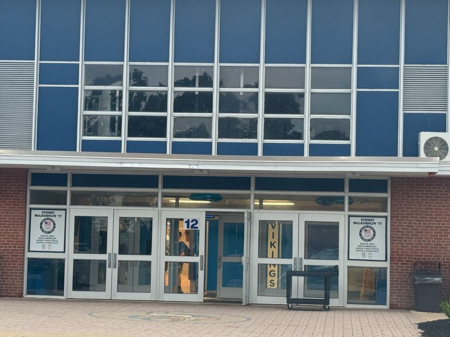 The glass entrance doors at Union Catholic, with Door 12 marked in blue above the open door